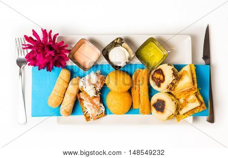 Tasting dish with venezuelan typical food .