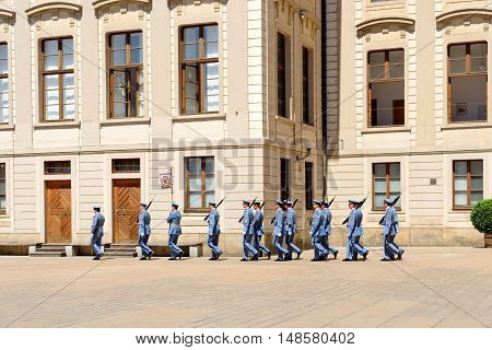 PRAGUE, CZECH REPUBLIC - JULY 4, 2014: Castle guards (Hradni straz) of presidential palace during ceremonial changing of guards. It takes place daily at noon accompanied by a brass band.