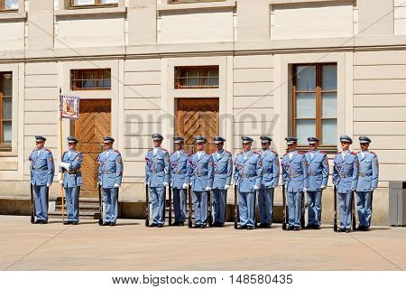 PRAGUE, CZECH REPUBLIC - JULY 4, 2014: Castle guards (Hradni straz) of presidential palace during ceremonial changing of guards. It takes place daily at noon accompanied by a brass band.