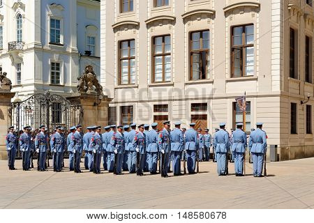 PRAGUE, CZECH REPUBLIC - JULY 4, 2014: Castle guards (Hradni straz) of presidential palace during ceremonial changing of guards. It takes place daily at noon accompanied by a brass band.