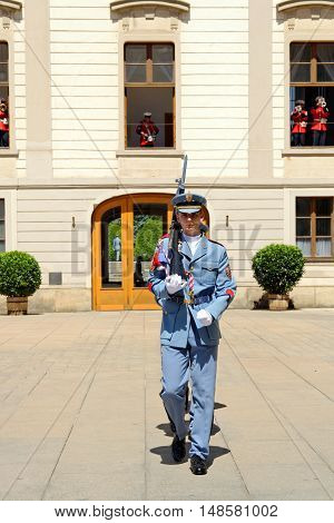PRAGUE CZECH REPUBLIC - JULY 4 2014: Castle guards (Hradni straz) of presidential palace during ceremonial changing of guards. It takes place daily at noon accompanied by a brass band.