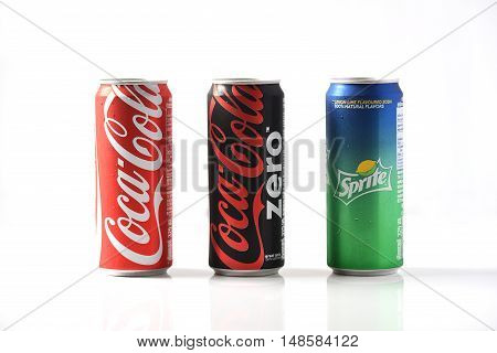 Bangkok, Thailand - September 23, 2016: Coca-Cola, Fanta and Sprite Cans Isolated On White. The three drinks produced by the Coca-Cola Company are the worlds best sold refreshing drinks.
