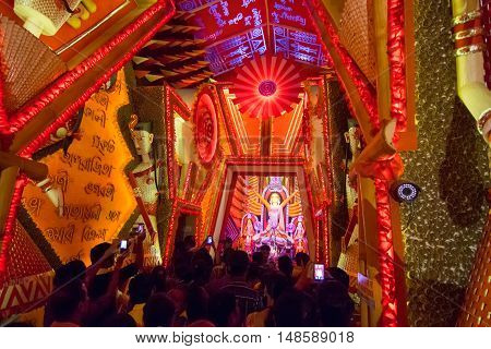 KOLKATA INDIA - OCTOBER 18 2015 : Night image of decorated Durga Puja pandal shot at colored light at Kolkata West Bengal India. Durga Puja is biggest religious festival of Hinduism.