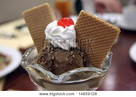 Coffee chocolate sundae with cream and wafers