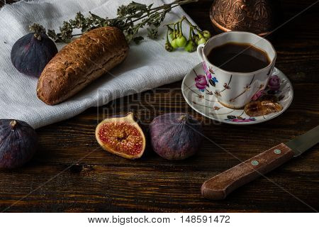 Light breakfast with hot coffee multigrain bread and few ripe juicy figs.