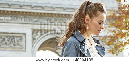 Pensive Modern Woman Near Arc De Triomphe In Paris, France
