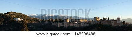 GRANADA, SPAIN - JANUARY 12, 2016: Panorama of the Alhambra Palace in Granada, Andalusia, Spain, pictured from the Mirador de San Nicolas in El Albayzin district. 