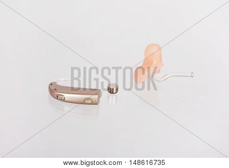 Hearing aids ear mould and a battery with their reflections