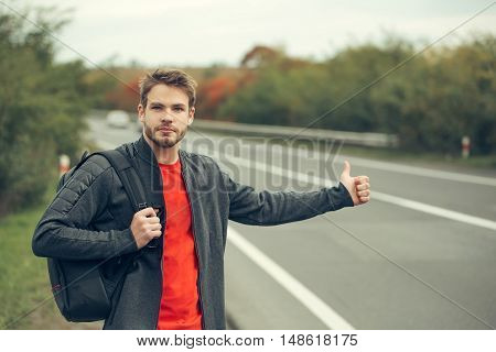 Young Man Hitchhiking