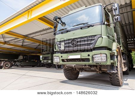 BURG / GERMANY - JUNE 25 : german mercedes benz axor stands under military roof on open day in barrack burg / germany at june 25 2016.