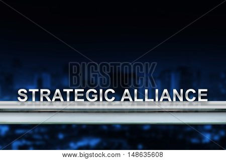 strategic alliance on metal railing with blurred background