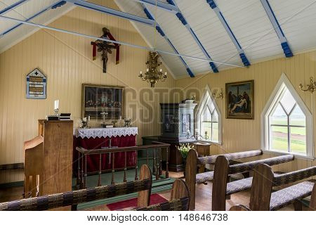 Brædratungu Iceland - June 25 2016: Interior Brædratungukirkja on Iceland with old benches paintings catheter and piano.