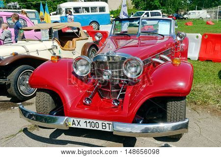 Kharkiv Ukraine - May 22 2016: Retro car red Mercedes-Benz Cabriolet manufactured in 1934 is presented at the festival of vintage cars Kharkiv Retro Rally - 2016 in Kharkiv Ukraine on May 22 2016