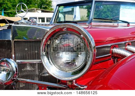 Kharkiv Ukraine - May 22 2016: Close up of retro car red Mercedes-Benz Cabriolet manufactured in 1934 is presented at the festival of vintage cars Kharkiv Retro Rally - 2016 in Kharkiv Ukraine on May 22 2016