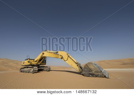 Abandoned Excavator in Liwa desert near Abu Dhabi