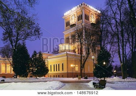 Rumyantsev-Paskevich Palace in snowy city park in Gomel, Belarus. Winter evening.