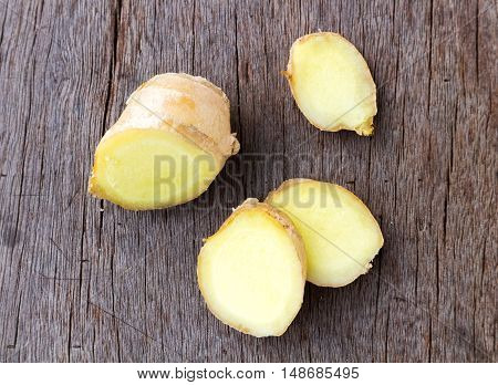 Fresh ginger on old wood background raw material for cooking