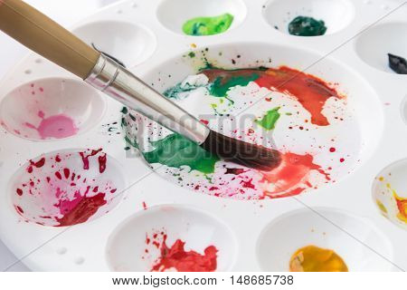 Closeup Paintbrush and Palette with watercolor artist concept