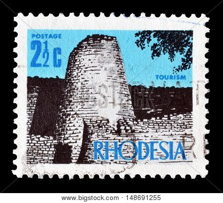 RHODESIA - CIRCA 1970 : Cancelled postage stamp printed by Rhodesia, that shows Ruins in Zimbabwe.