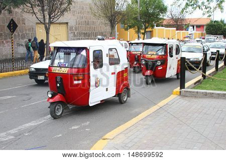 Cajamarca Peru - September 23 2016: Moto-taxi traffic on busy street in Cajamarca Peru on September 23 2016
