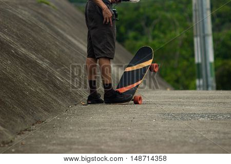 a young boy with his skate waiting for the moment