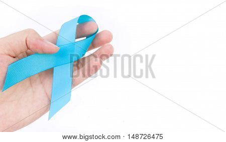 Hand hold blue ribbon on white background prostate cancer awareness concept