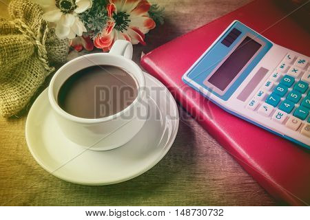 Cup Of Coffee, Books And Calculator, On Table Wood