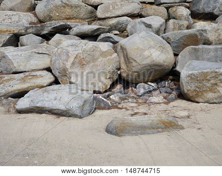 Big stones on the beach placed to protect the dunes from the ravages of the sea waves