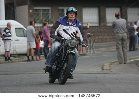 BELGRADE, SERBIA - SEPTEMBER 10, 2016: Oldtimer BMW motorcycle at the commercial race of old cars in memory of formula 1 race held on the same place in 1939 two days after the beginning of Second World War when the famous Italian driver Tazio Nuvolari won