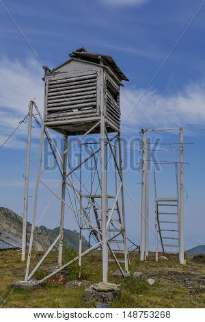 Old weather station in the top of the mountains. Abandoned old box for the meteorological equipment.