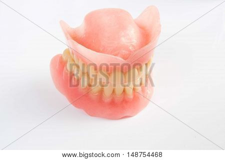 Dental smile jaws teeth on white background. Tooth prosthesis.