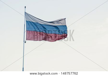 Russian tricoloured flag waving in the wind.