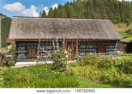 CICMANY, SLOVAK REPUBLIC, AUGUST 23, 2016: Traditional folk architecture. The old wooden house painted ornament. The village Cicmany with the painted wooden houses is on the list of UNESCO.