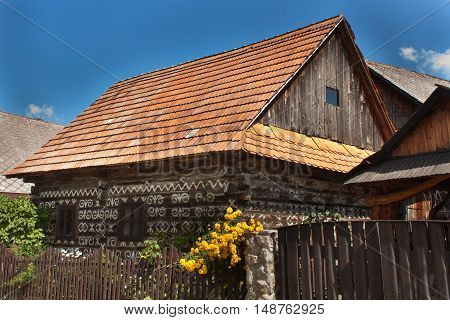 CICMANY, SLOVAK REPUBLIC, AUGUST 23, 2016: Traditional folk architecture. The old wooden house painted ornament. The village Cicmany with the painted wooden houses is on the list of UNESCO.