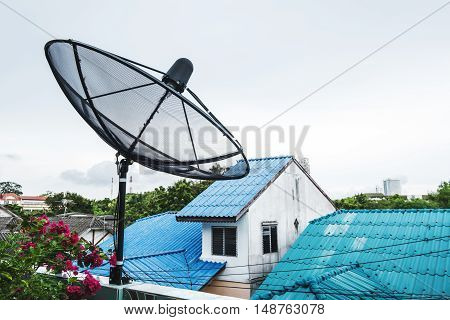 Home Satellite Dish on a roof top in rural area