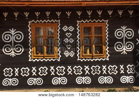 CICMANY, SLOVAK REPUBLIC, AUGUST 23, 2016: Traditional folk architecture. The old wooden house painted ornament. The village Cicmany with the painted wooden houses is on the list of UNESCO.