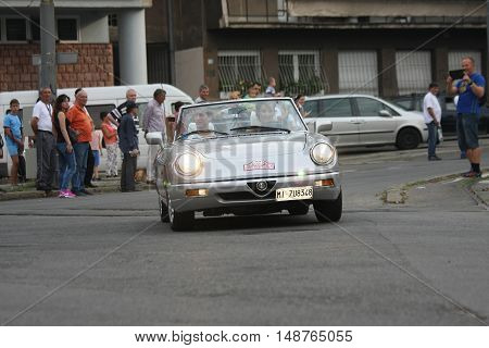 BELGRADE,SERBIA - SEPTEMBER 10, 2016: Guests from Italy at the commercial race of old cars in memory of formula 1 race held on the same place in 1939 two days after the beginning of Second World War when the famous Italian driver Tazio Nuvolari won