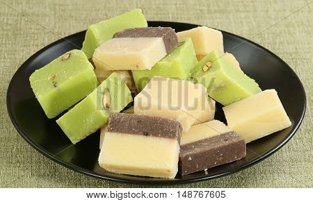 selection of fresh creamy barfi plain chocolate and pistachio