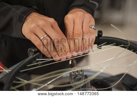 Close Up Of Tennis Stringer Hands Doing Racket Stringing