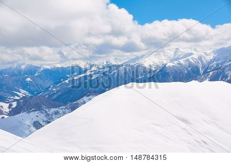 Road to freeride peak high in mountains. Winter extreme snowboard and ski concept. Heliski peak for strong and brave people. Adventure riding.