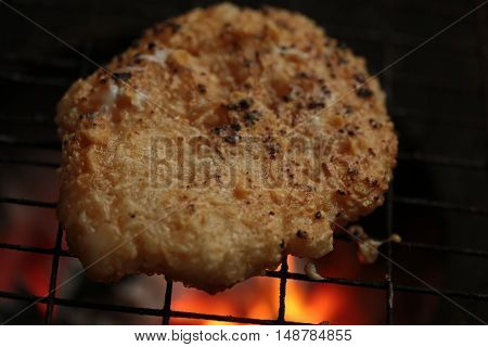 sticky rice with egg grilled Asian traditional food (Kgawhie) at street food in Thailand.