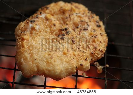 sticky rice with egg grilled Asian traditional food (Kgawhie) at street food in Thailand.