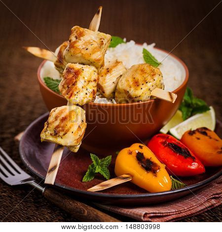 Chicken Kebab or Kabob Skewers with Rice. Selective focus.