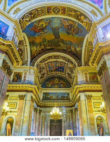 SAINT PETERSBURG RUSSIA - APRIL 25 2015: The splendid prayer hall of St Isaac's Cathedral that boasts several tons of silver and golden embellishments on April 25 in Saint Petersburg.