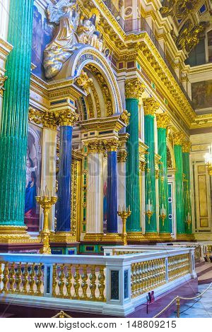 SAINT PETERSBURG RUSSIA - APRIL 25 2015: The iconostasis of St Isaac's Cathedral is framed by semiprecious stone columns green malachite and blue lazurite on April 25 in Saint Petersburg.