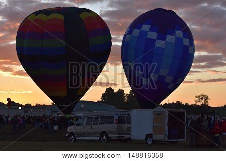 QUEENSBURY, NY - SEP 24: Balloon launch at dawn at the 2016 Adirondack Hot Air Balloon Festival held from Sep 22-25. Thousands of people attended the festival which is the largest of its kind on the East coast.