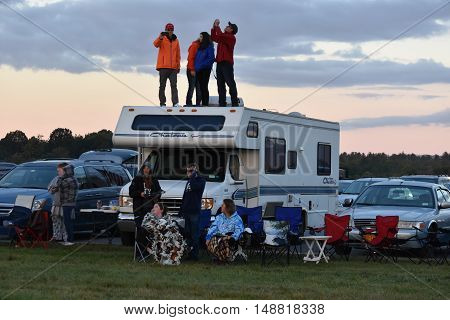 QUEENSBURY, NY - SEP 24: Balloon launch at dawn at the 2016 Adirondack Hot Air Balloon Festival held from Sep 22-25. Thousands of people attended the festival which is the largest of its kind on the East coast.
