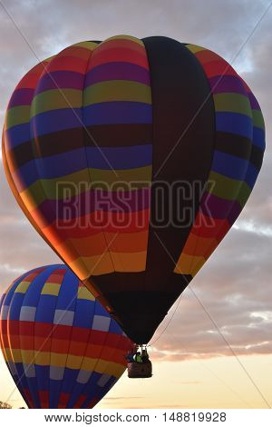 QUEENSBURY, NY - SEP 24: Balloon launch at dawn at the 2016 Adirondack Hot Air Balloon Festival held from Sep 22-25. Thousands of people attended the festival which is the largest of its kind on the East coast.