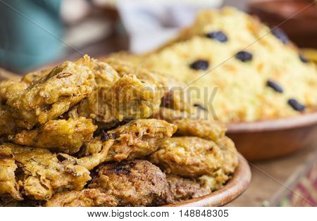 Vegetables fried rolls in batter also called Mshat Zahra and couscous. Moroccan recipes