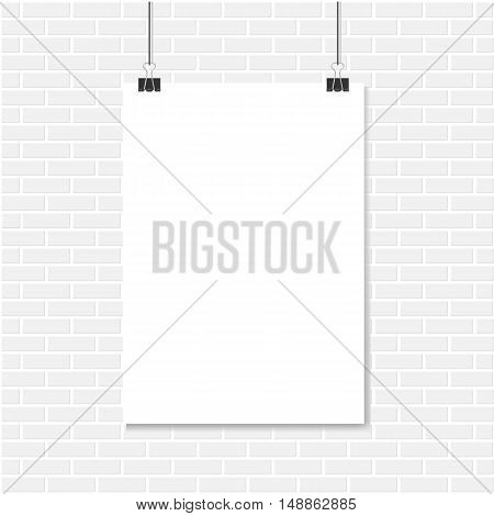 White brick wall and vertical realistic poster mockup A4 on a rope